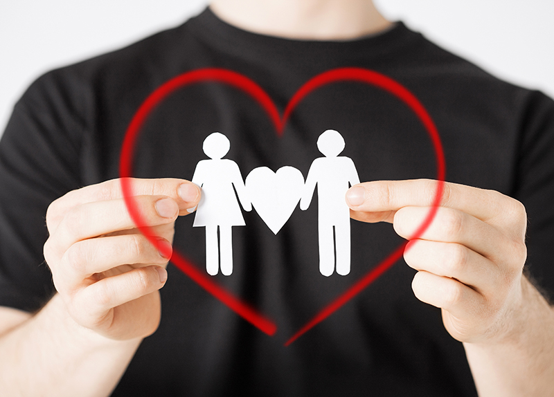 http://www.dreamstime.com/stock-photography-man-hands-paper-men-family-relationships-concept-showing-two-heart-shape-image37203522
