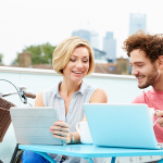 http://www.dreamstime.com/stock-images-couple-roof-terrace-using-laptop-digital-tablet-sitting-table-bike-background-image40094344
